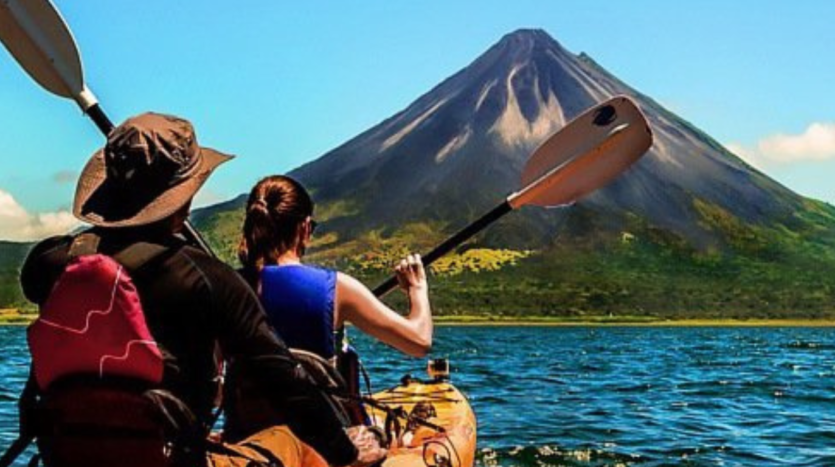 A diverse group of individuals enjoying a rafting adventure on a scenic river, surrounded by lush greenery