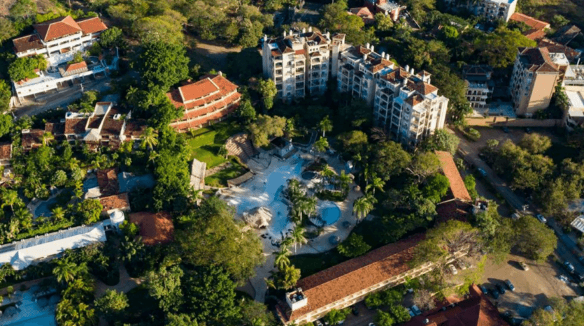 Aerial view showcasing the hotel and its surrounding landscape, highlighting the architecture and natural features.