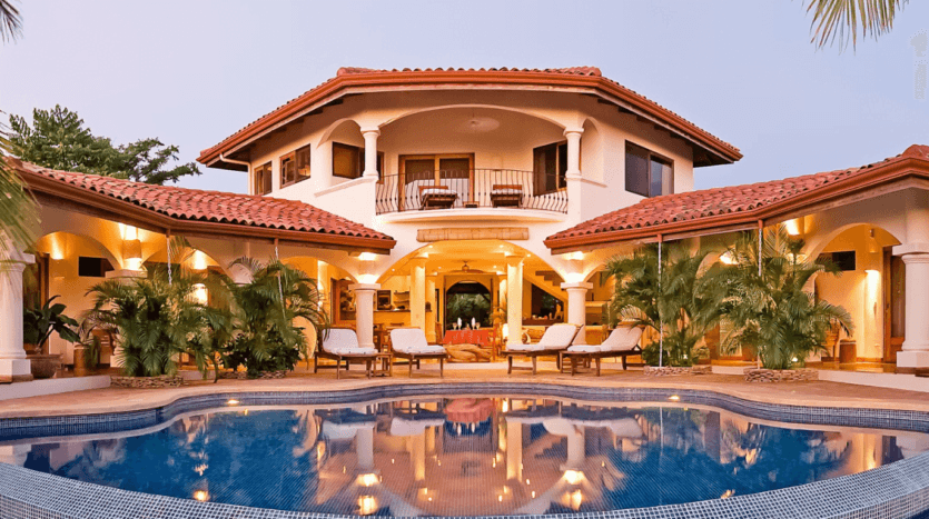 A stunning home featuring a serene pool and inviting patio, perfect for relaxation and outdoor gatherings.